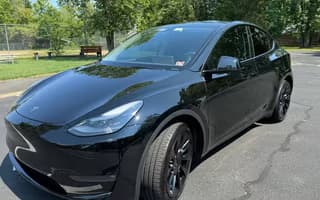 2023 Tesla Model Y Long Range AWD in Solid Black, Front Left